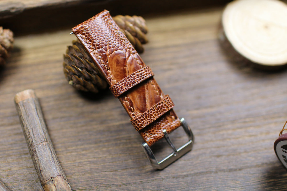 British tan ostrich leg strap short piece with keepers and silver buckle